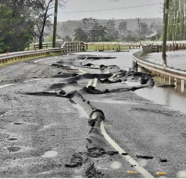 Crumpled bitumen road damaged by flood waters in 2022