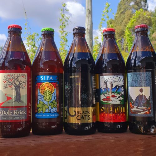 Five bottles; each contains a different beer: Mole Kriek, SIPA, 3 Black Cats, Smokin' Bagpipes and Black Inca